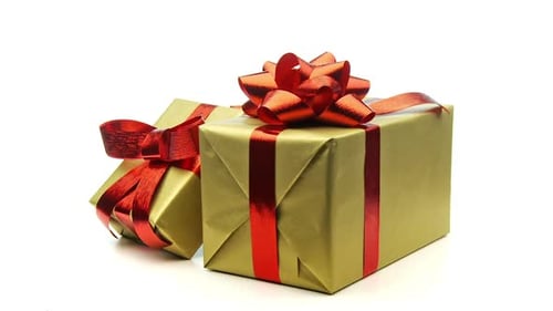 Gold Presents with Red Ribbon on White Background