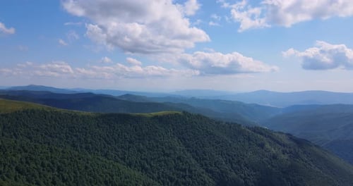 Aerial View of Green Mountains Under Blue Sky