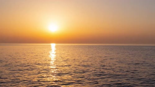 Sea sunset timelapse background. Sunset goes to ocean. Timelapse Sunset.