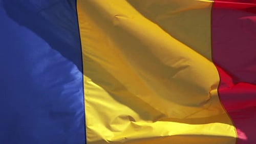 Blue, Yellow, and Red Flag Waving