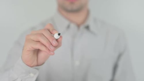 Man Writes the Word "News" on Clear Surface