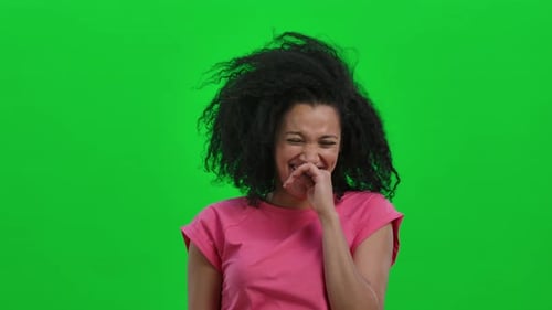 Laughing Woman with Curly Hair in Studio