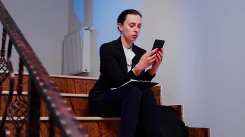 Lady Doing Overtime for Deadline Project Using Smartphone