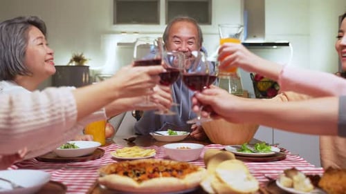 Family Gathering Together for Meal and a Toast