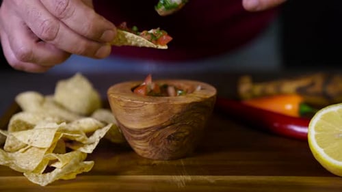 Serving Salsa with Tortilla Chips on Wooden Board