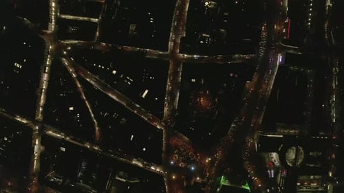 Birds Eye Shot of Cars Driving on Streets in Urban Neighbourhood in Night City