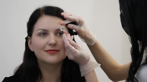 Beautician Makes Eyebrow Correction