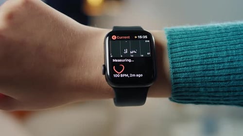Smartwatch Displaying Heart Rate Monitoring Application