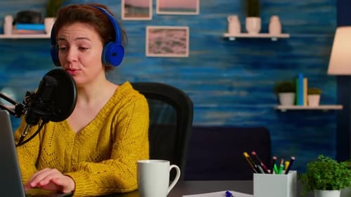 Woman Podcasting at Home with Laptop and Microphone