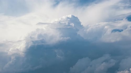 Timelapse of White Puffy Cumulus Clouds Forming on Summer Blue Sky