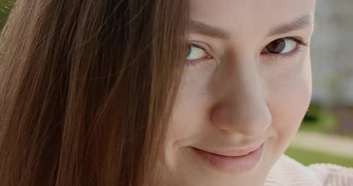 Face Young Sunshine Woman with a Brown Eyes Look at Camera Smile Stand in the City Streets Summer