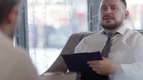 Men Studying Documents