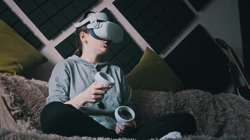 Teenage Girl Wearing VR Headset at Home