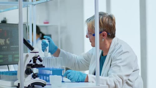 Senior Scientist Working in Bright Laboratory