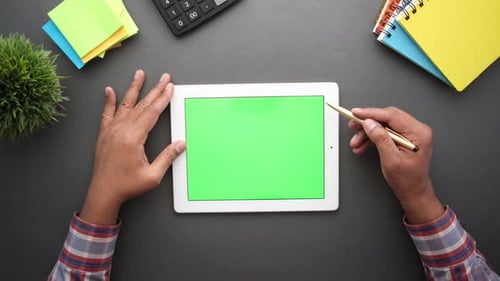 Flat Composition of Young Man Suing Digital Tablet on Office Desk