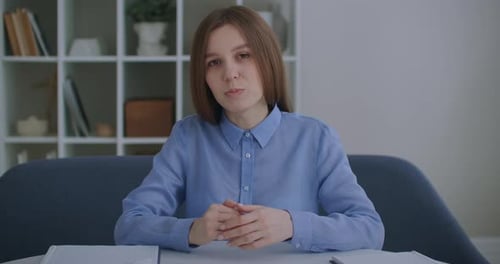 Confident Businesswoman Webinar Speaker Coach Teacher Talking Looking at Camera. Woman in Office