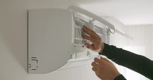 Opening Air Conditioner to Remove Dirty Filter