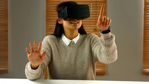 Young Woman Using VR Headset Indoors