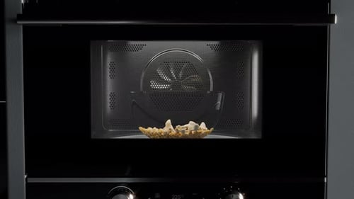 Realistic Popcorn Popping in a Microwave Oven