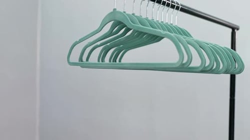 Hangers arranged on clothes rack 4K 4k