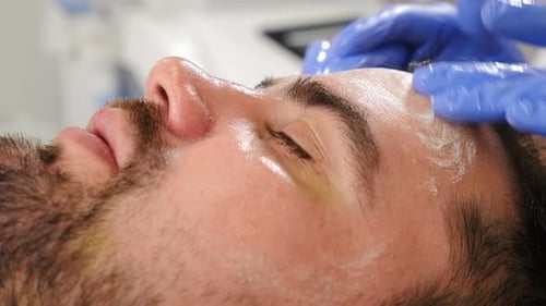 Man Receiving Facial Treatment at Spa, Close Up