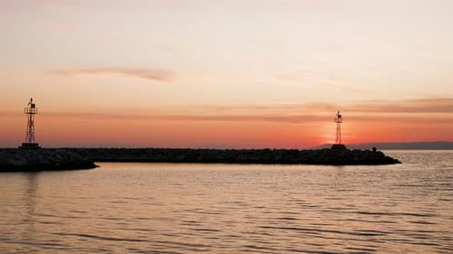 Ocean Breakwaters at Sunrise with Tranquil Water
