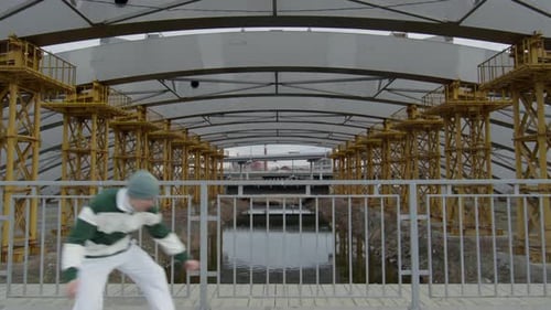 Young Adult Performing Parkour Trick on Bridge