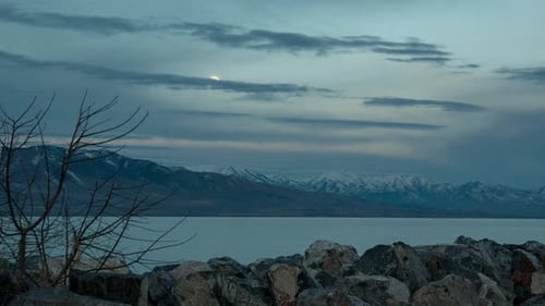 Time lapse of a Full Moon setting at sunrise over Utah Lake