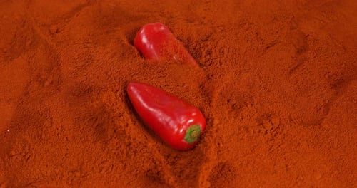 Paprika, capsicum annuum, falling on Paprika Powder, Slow Motion 4K