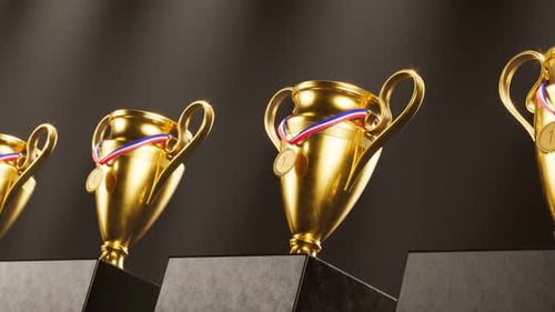 An endless row of cups and medals for winners. Trophies for sports champions.