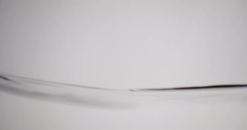 Water Surface In Motion Against White Background