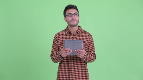 Young Adult with Tablet, Green Screen Background