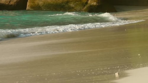 Waves Rolled on the Sand of Beach