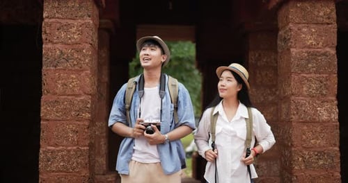 Couple takes a photo and visits ancient temple