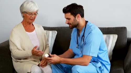 Doctor Explains Medication to Senior Woman