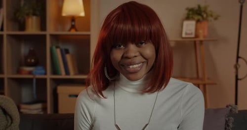 Close Up View of Happy Young Afro American Woman Looking To Camera