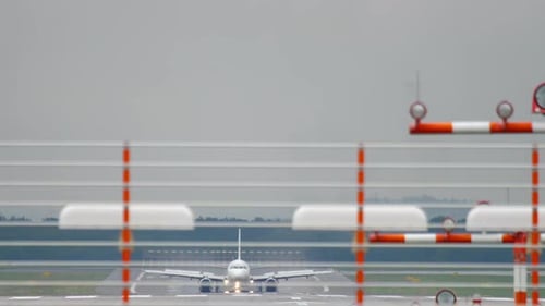 Airplane Braking After Landing at Wet Weather
