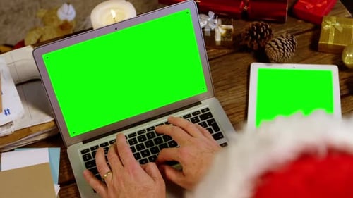 Santa claus using laptop