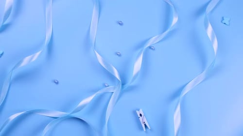 Blue Background with Satin Ribbons Concept of Boy and Newborn Birthday Celebration or Blue Party