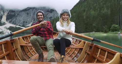 Happy Couple Enjoying Boat Ride on Scenic Lake