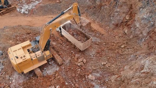 Excavator Fills Dump Truck