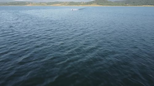 Aerial View of a Scooter at the Lake Surface