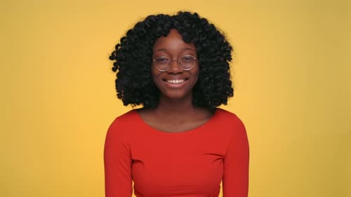 Young Adult Woman Smiling in Studio Setting