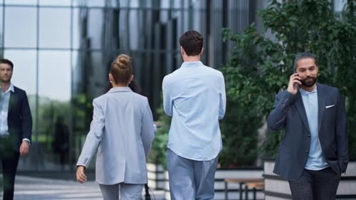 Corporate Employees Walking Downtown Street