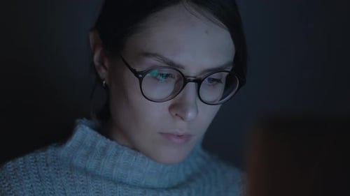 Beautiful woman use smartphone at night. Close up. 4k.