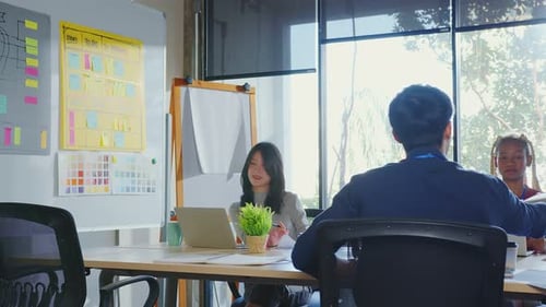 brainstorming about mobile app interface workflow design on table with coworker breif