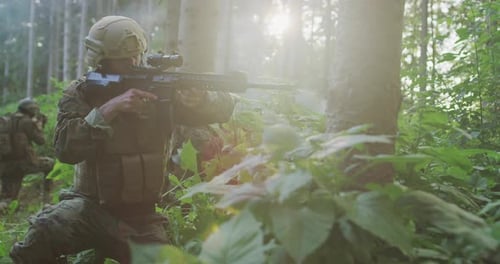 Soldiers Armed with Rifles in Forest on Mission