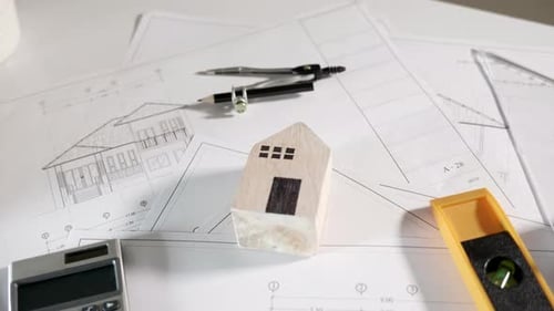Top view of house plan blueprint paper with repair tools on table desk at architecture office