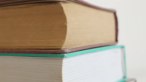 Stacked deckle edge paper material or archives 4K 2160p 30fps UltraHD tilting footage - Close-up of