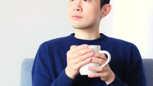 Thoughtful man having coffee 4k